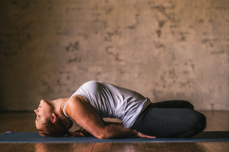 Woman in fish yoga pose