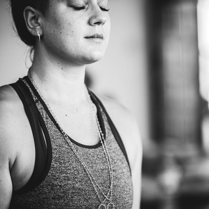 Black and white photo of a woman meditating