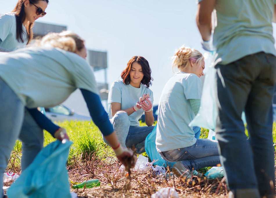 Group of people picking up trash 