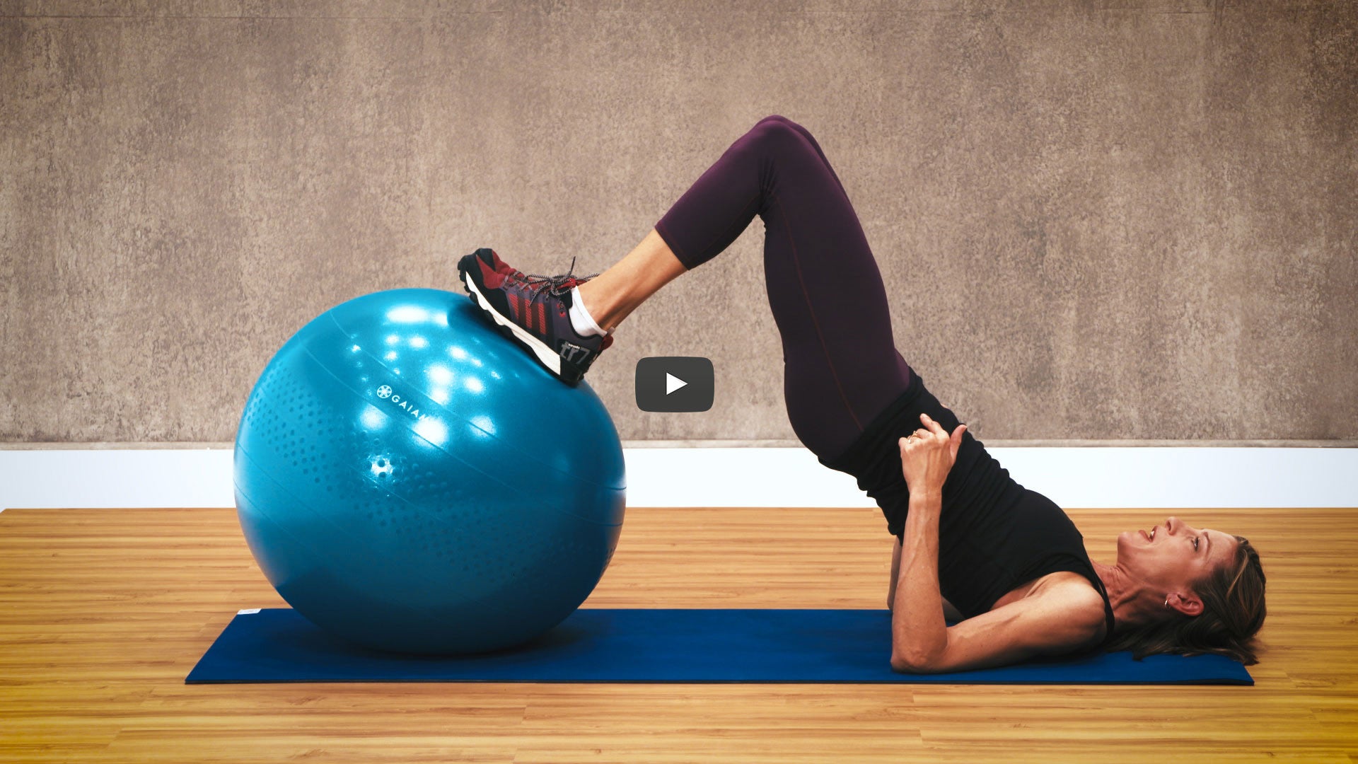 Woman in glute bridge on a balance ball 