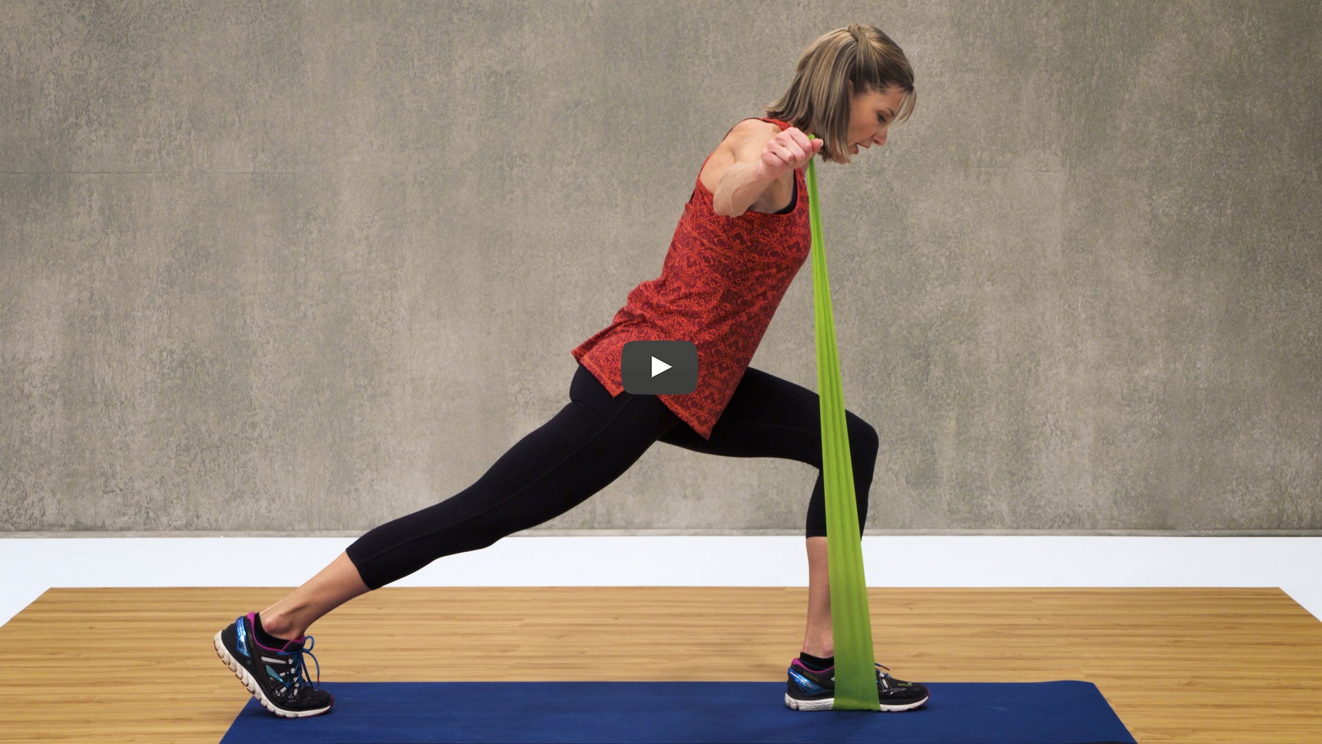 Woman lunging with resistance band 