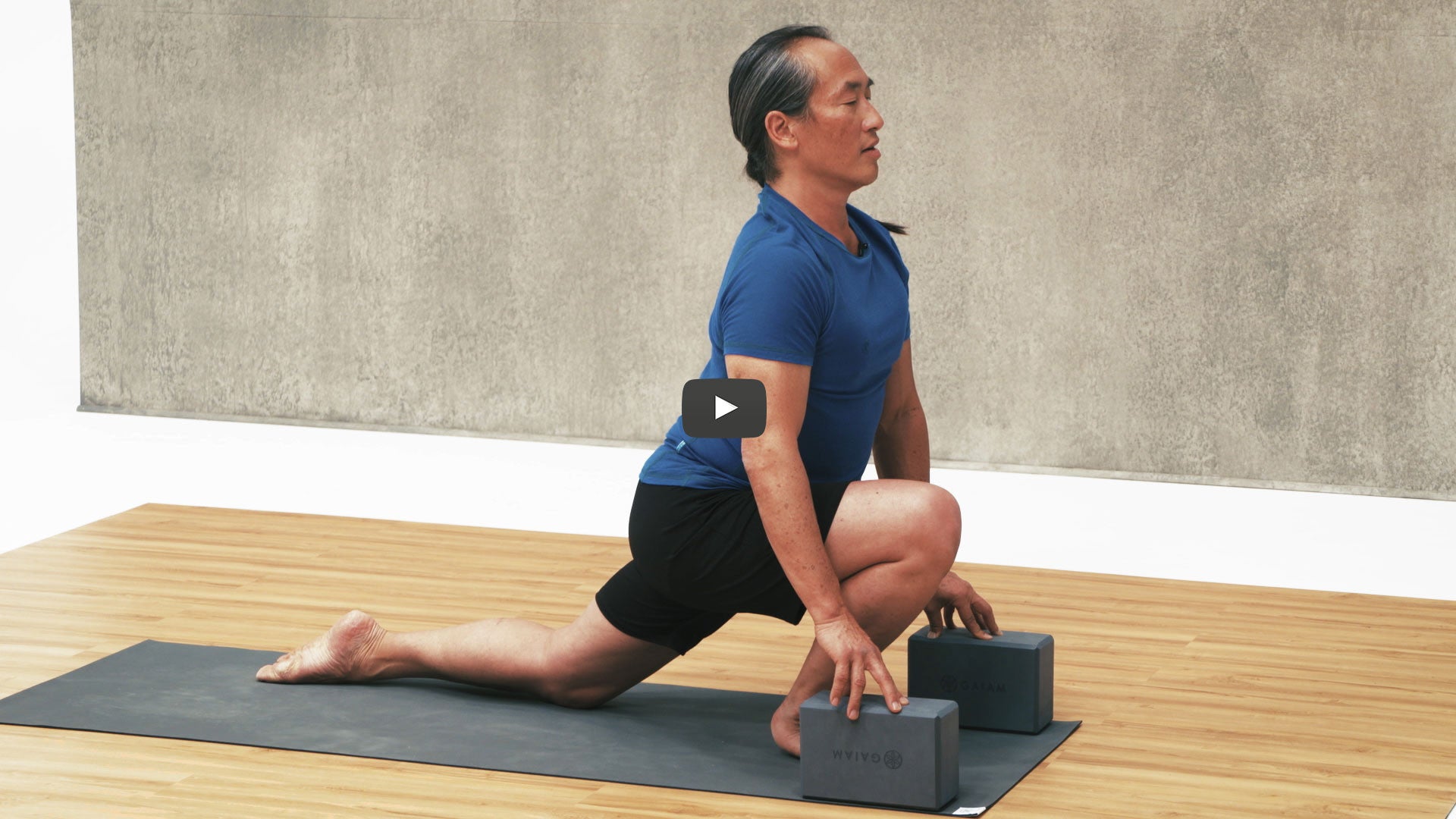 Rodney Yee does lunge with yoga blocks