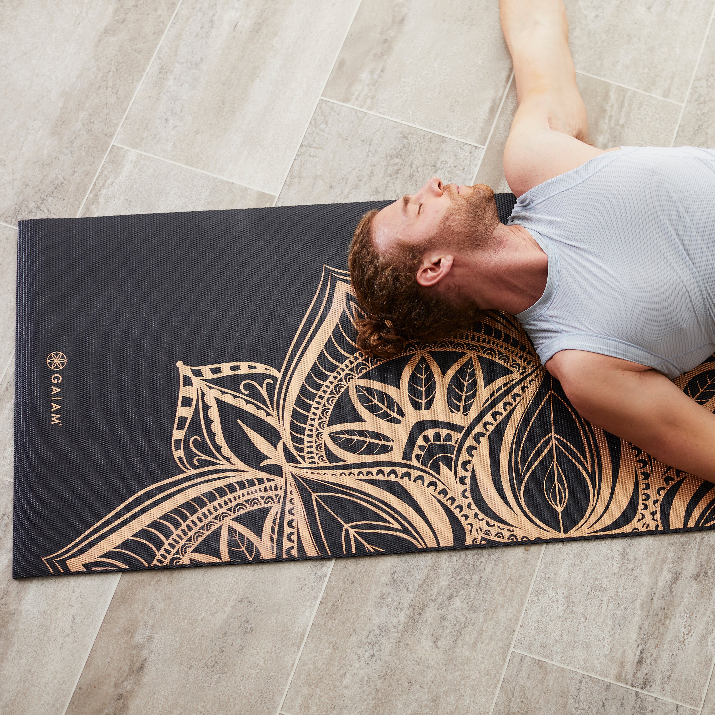Man laying on mat 